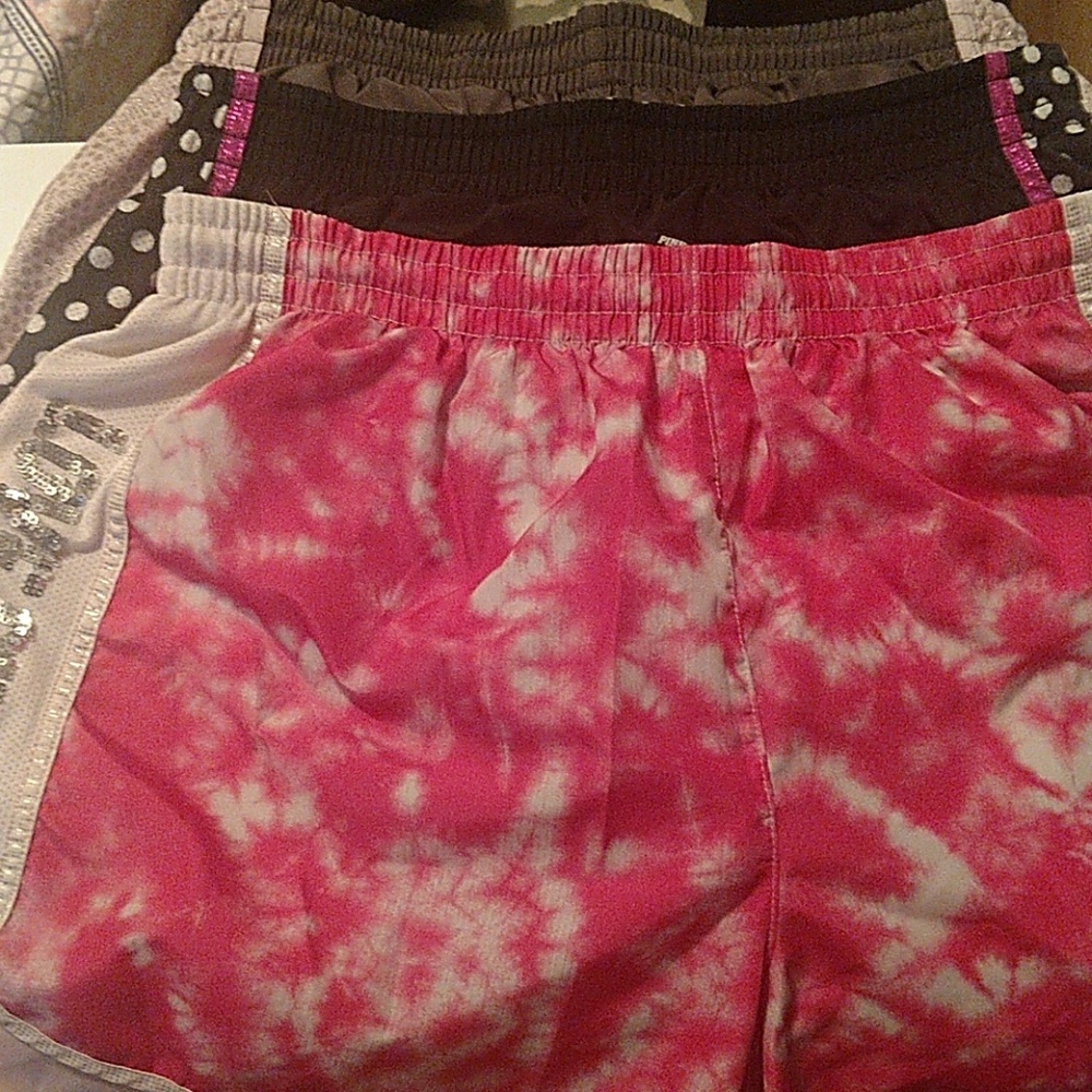 Pink athletic shorts.
